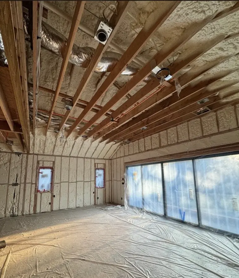 Interior walls and ceiling insulated with spray foam during new construction in West Des Moines